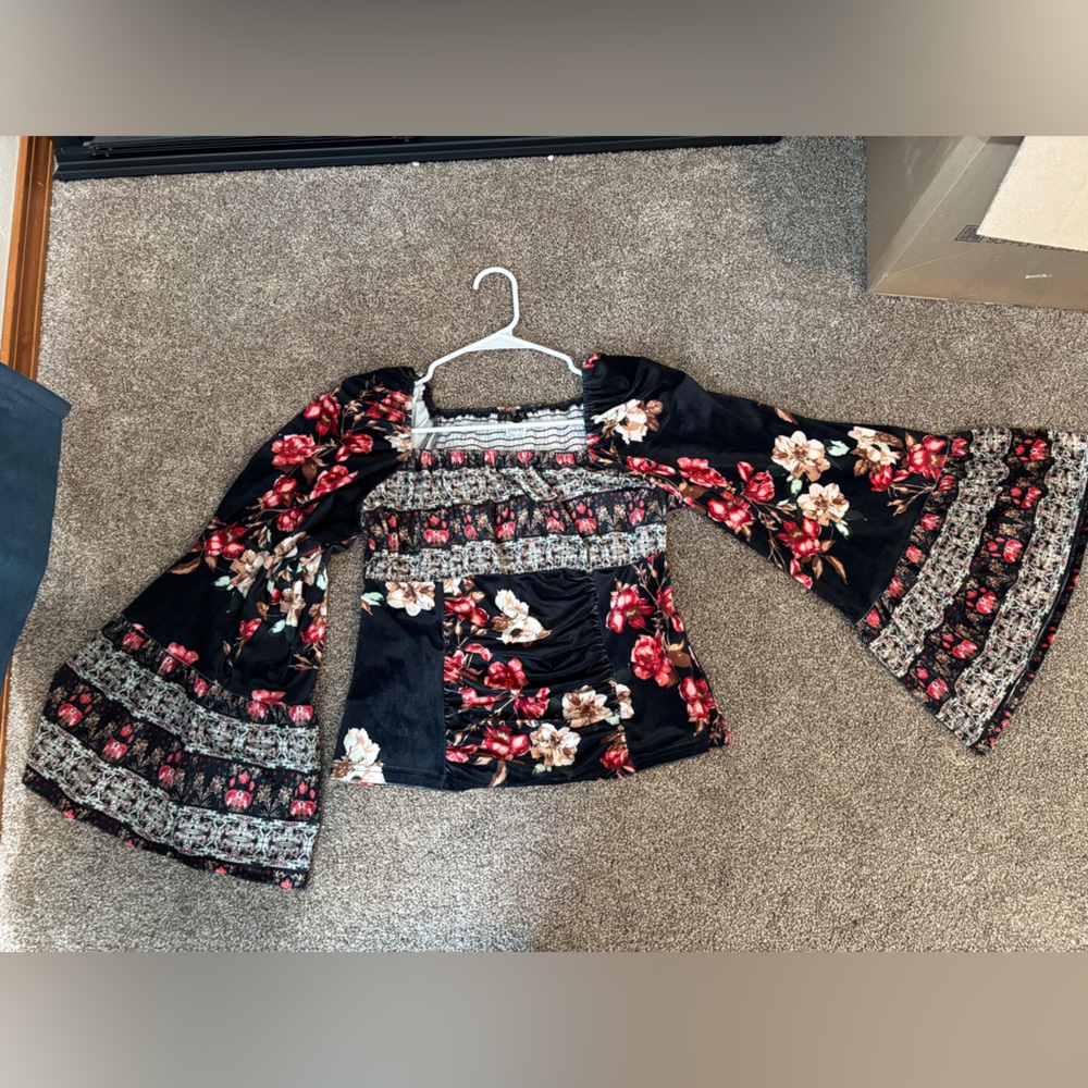 Women’s smocked bell sleeved top